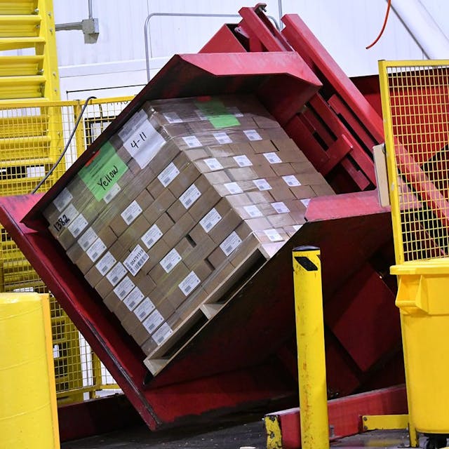 Machine rotating product that is stacking on a pallet.